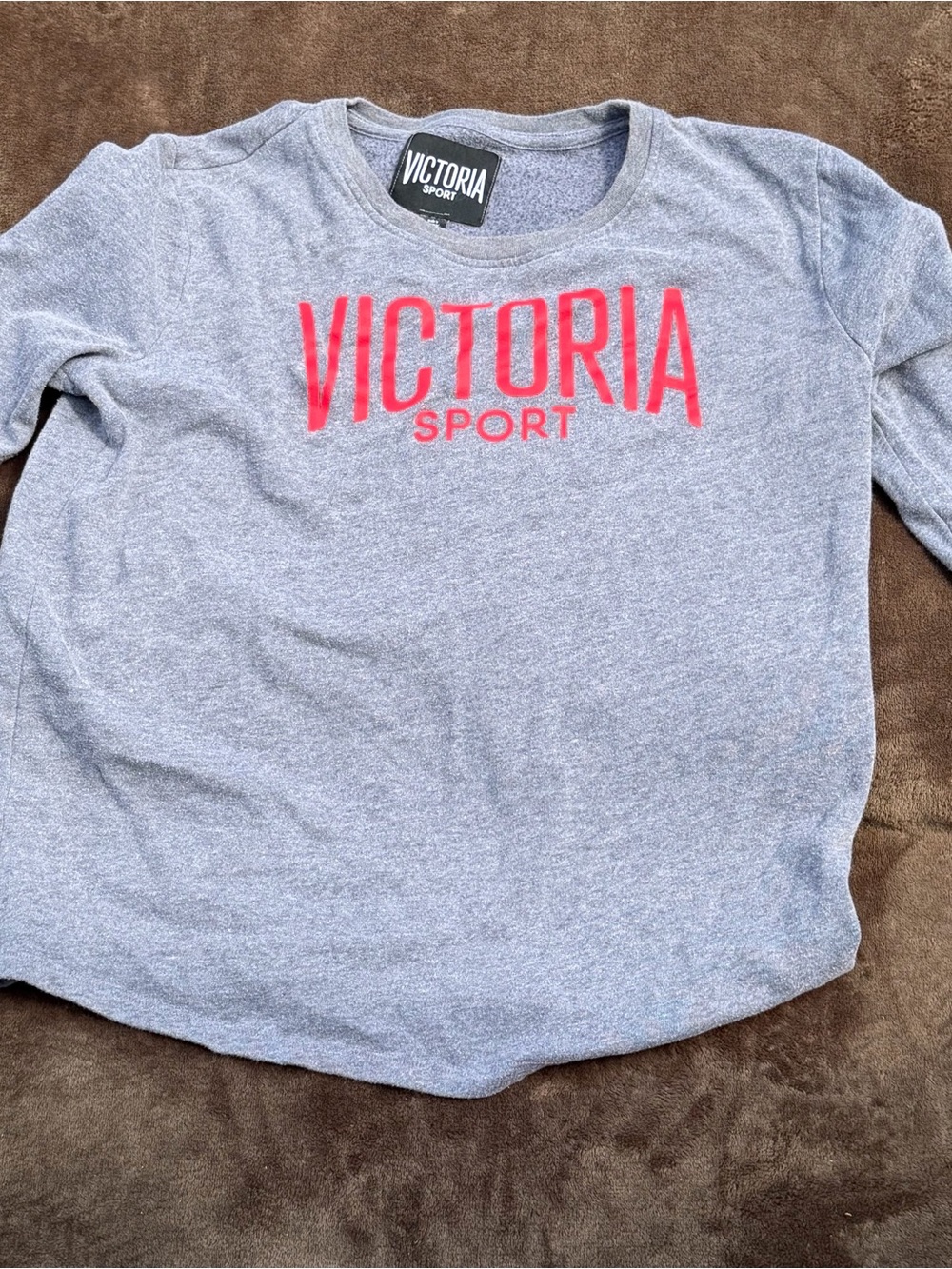 gray Victoria's Secret Sport crewneck pullover sweatshirt featuring a red logo